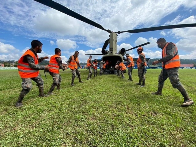 In partnership with Guatemalan forces, Joint Task Force-Bravo unloads emergency supplies from a U.S. Army CH-47 Chinook assigned to the 1-228th Aviation Regiment in Alta Verapaz, Guatemala, Nov. 8 2020, to assist the victims of Tropical Depression...