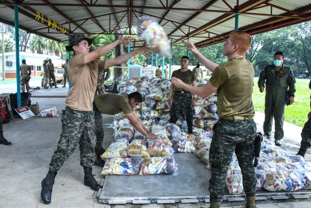Honduran soldiers palletize life-saving supplies to load for delivery to Urraco, Honduras at San Pedro Sula, Honduras, Nov. 11, 2020. JTF-Bravo&#39;s forward deployment to Honduras highlights the importance of cooperation and training with...