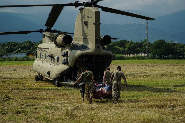 Joint Task Force-Bravo members and Honduran soldiers load life-saving supplies on a U.S. Army CH-47 Chinook helicopter, assigned to the 1-228th Aviation Regiment, JTF-Bravo, for delivery to Choloma, Honduras at San Pedro Sula, Honduras, Nov. 9,...