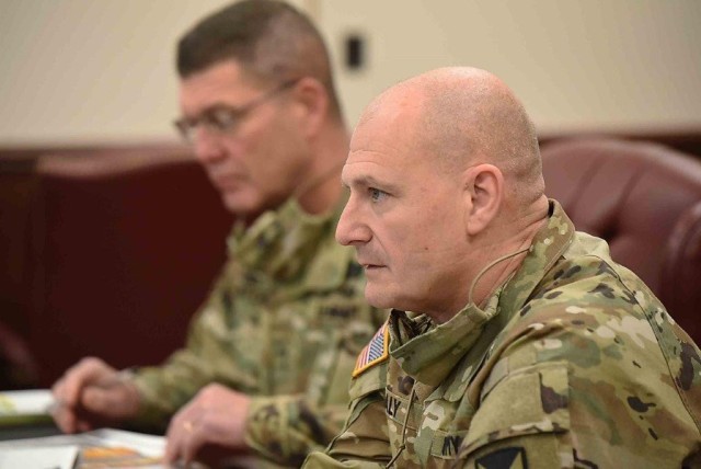 Gen. Ed Daly, commanding general, U.S. Army Materiel Command, listens along with Maj. Gen. Daniel Mitchell, commanding general, U.S. Army Sustainment Command, during a quarterly update meeting for Daly Nov. 19 at ASC on Rock Island Arsenal, Illinois. Daly served as the ASC commanding general from August 2016 to July 2017.