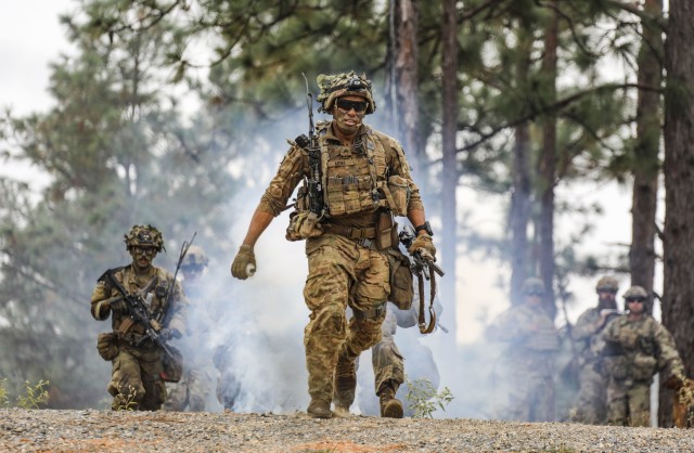 Sgt. Arlex Mena, an infantryman with 1st Battalion, 27th Infantry Regiment "Wolfhounds", 2nd Infantry Brigade Combat Team, 25th Infantry Division, leads his team through the breach point during the final live fire exercise of rotation 21-01 on October 27th, 2020 at the Joint Readiness Training Center at Fort Polk, Lousiana. The JRTC exercise is a capstone training event that allows 2nd Brigade to achieve certification for worldwide deployment while building interoperability with key allies in support of a free and open Indo-Pacific. (U.S. Army photo by Sgt. Thomas Calvert)