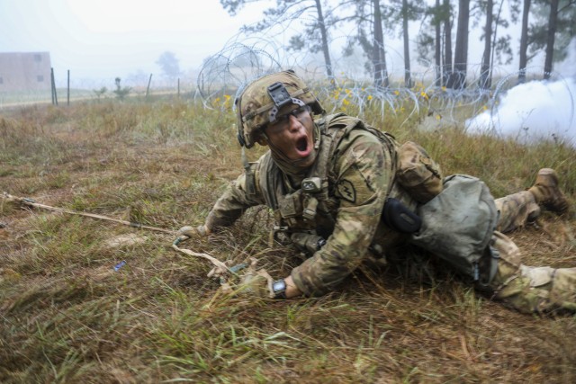 A combat engineer with 65th Brigade Engineer Battalion, 2nd Infantry Brigade Combat Team, 25th Infantry Division, hooks the wired obstacle during the final live fire exercise of rotation 21-01 on October 27th, 2020 at the Joint Readiness Training Center at Fort Polk, Lousiana. The JRTC exercise is a capstone training event that allows 2nd Brigade to achieve certification for worldwide deployment while building interoperability with key allies in support of a free and open Indo-Pacific. (U.S. Army photo by Sgt. Thomas Calvert)