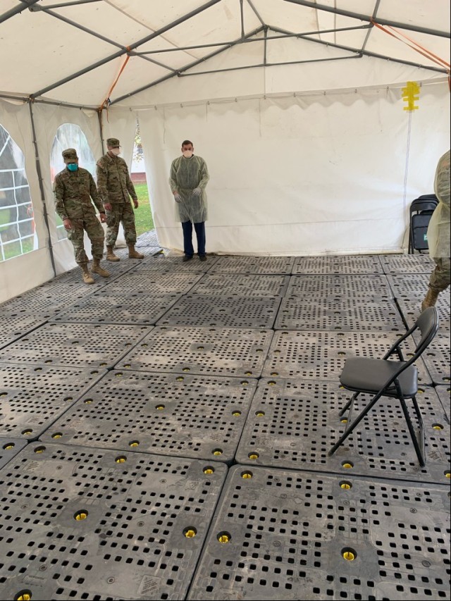 AFTER: The inside of the COVID testing center tent on Clay Kaserne is now lined with heavy duty plastic pallets that will keep patients out of the mud.