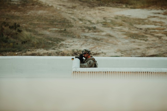A Trooper assigned to 1st Battalion, 12th Cavalry Regiment, 3rd Armored Brigade Combat Team, 1st Cavalry Division, acts as an opposing force during the testing of the newest version of the Bradley Fighting Vehicle, Fort Hood, Texas, Oct. 24, 2020. Operational testing with the U.S. Army Operational Test Command (OTC), places First Team Troopers in a series of maneuvers and engagements where OTC can properly test the new vehicles.  (U.S. Army photo by Sgt. Calab Franklin, 3ABCT, 1CD, PA NCOIC)
