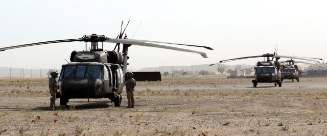 Pilots and flight crews from the 1st Assault Helicopter Battalion, 140th Aviation Regiment, 40th Combat Aviation Brigade, conduct routine training operations on the flight line at Camp Roberts on Nov. 6, 2020 during annual training. (U.S. Army National Guard photos by Sgt. 1st Class Ryan Sheldon)