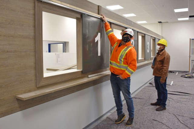 WIESBADEN, Germany – Chad Adamson, construction control representative with the U.S. Army Corps of Engineers Europe District, shows where the sign to indicate the express window will be located Nov. 17, 2020, in Bldg. 1030 on Clay Kaserne.