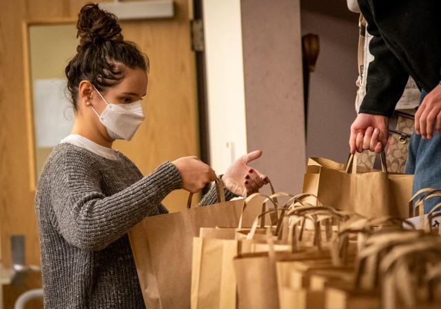CAMP HUMPHREYS, Republic of Korea – A volunteer lines up and organizes completed welcome bags during a Bag Brigade Drive at the Freedom Chapel here, Nov. 21. The Bag Brigade Drive event allowed volunteers to assemble welcome bags for newly...