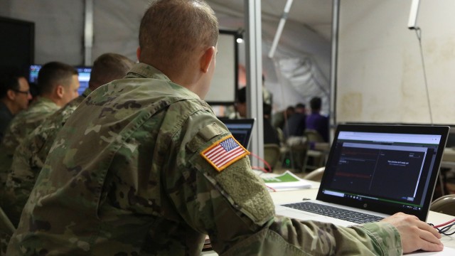 Soldiers analyze cyber communications during Cyber Quest 2019 at Fort Gordon, Ga., in June. The mission of Cyber Quest is to conduct prototyping experiments that demonstrate capabilities with the potential to quickly close high-priority technology gaps. Army G-6 leaders are currently working to create a unified network by collapsing the divide between the enterprise and tactical systems.