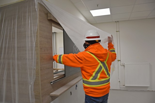 WIESBADEN, Germany – Chad Adamson, construction control representative with the U.S. Army Corps of Engineers Europe District, shows a future mail pick-up window Nov. 17, 2020, in Bldg. 1030 on Clay Kaserne.