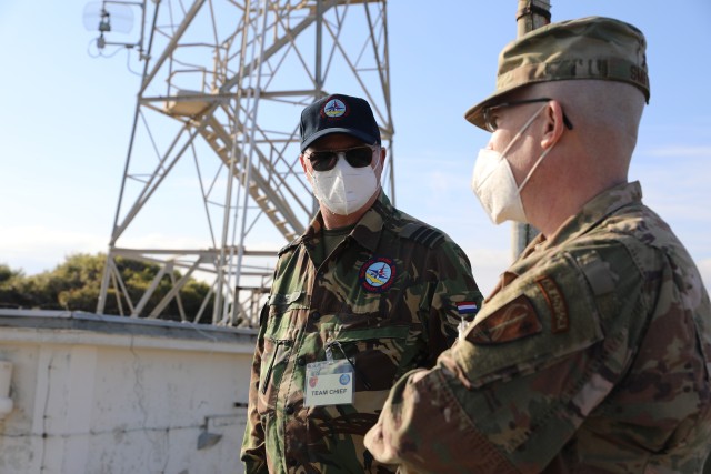 Netherlands Air Force Lt. Col. Rudi Snel, team chief of the exercises evaluation team assigned to NATO Air Command Headquarters, and HQ Air Comm. representative and logistics officer U.S. Air Force Maj. Jones Smith observed and discussed the...