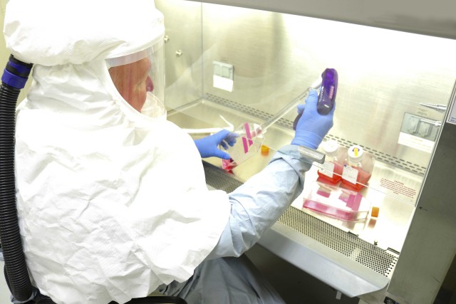 Brian Kearney, a research microbiologist, harvests samples of the coronavirus in a Biosafety Level 3 laboratory at the U.S. Army Medical Research Institute of Infectious Diseases at Fort Detrick, Md., March 3, 2020. This virus stock’s purpose is to develop models of infection for coronavirus, as well as diagnostic tests, vaccines and therapeutics.