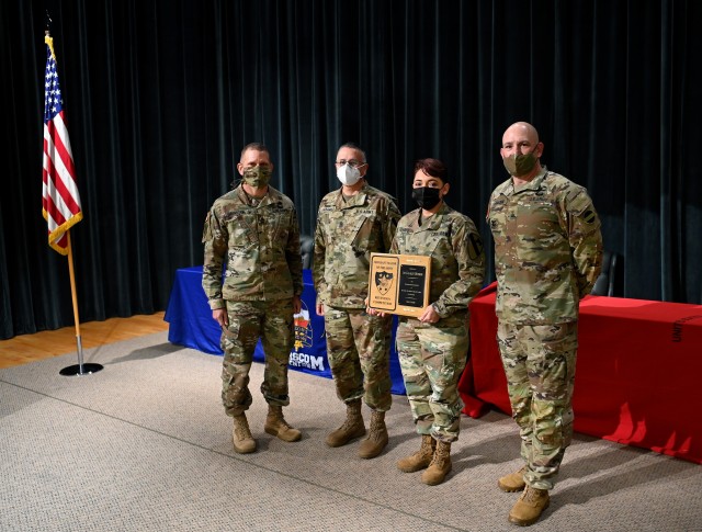 Sergeant Major of the Army Michael A. Grinston presents Retention Awards to Noncommissioned Officers during a ceremony at Fort Bragg, North Carolina November 19, 2020. (U.S. Army photo by K. Kassens)