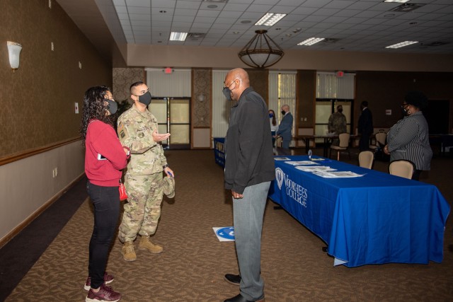 A Soldier speaks with a college representative at the Fort Jackson Education Fair, Nov. 18. 