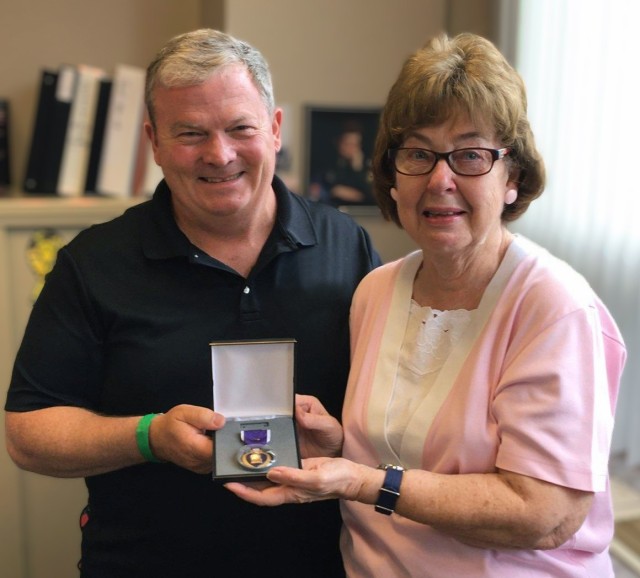 Bob Healy, recovery care coordinator at Fort Drum, helped Suzanne Adderley replace medals that her late husband, Pfc. Charles Farney, was awarded during his service in the Korean War. Farney was awarded the Bronze Star with Valor and two Purple...