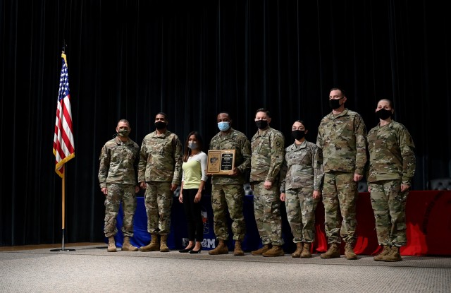 Sergeant Major of the Army Michael A. Grinston presents Retention Awards to Noncommissioned Officers during a ceremony at Fort Bragg, North Carolina November 19, 2020. (U.S. Army photo by K. Kassens)