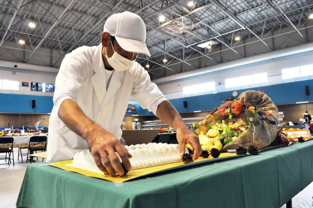 Akitoshi Higuchi, a foreman cook at the Camp Zama Dining Facility, makes sure decorations are just right in preparation for the traditional Thanksgiving luncheon at Camp Zama, Japan, Nov. 25.