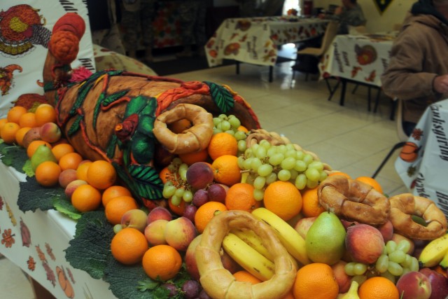 A cornucopia made of styrofoam spills bread and fruits. It is one of several such decorations serving Thanksgiving food at the dining facility at Camp Wright in Asadabad, Afghanistan, Nov. 26, 2009. Soldiers, sailors, airmen, contractors and locals all ate together throughout the day and into the night remembering to be thankful for friendship and fellowship.