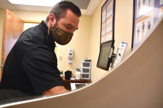 This is the view from inside the Army Wellness Center’s bod pod as Eric Middleton, AWC director, begins taking body measurements Nov. 16.