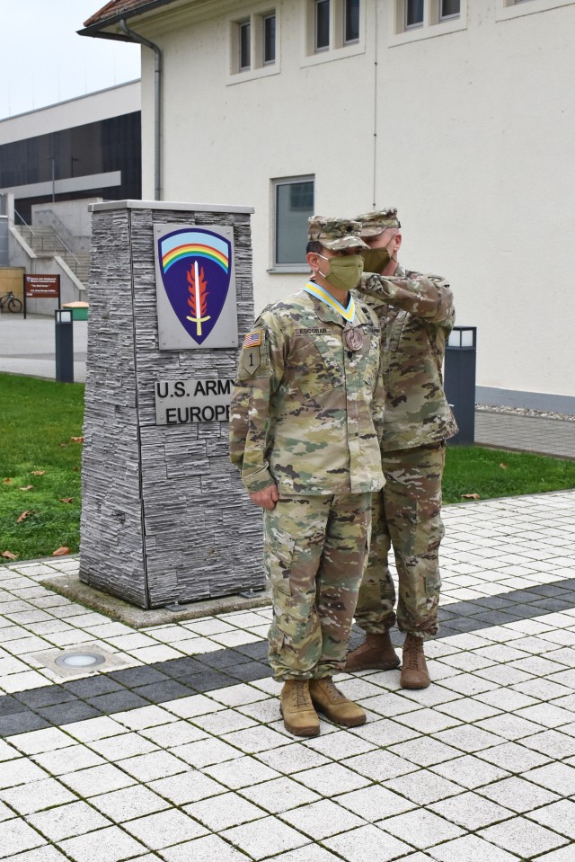 WIESBADEN, Germany – Lt. Col. Edwin Escobar, U.S. Army Garrison Wiesbaden provost marshal and director of emergency services, is presented with the Order of St. Maurice, Legionnaire, by Col. Howard Kirk, executive officer to the commanding...