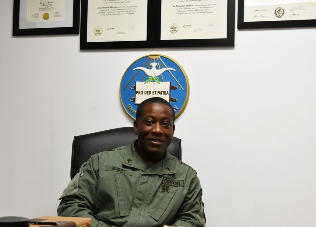 Chap. (Capt.) Jamar Mabry, Joint Readiness Training Center Operations Group, at his desk.