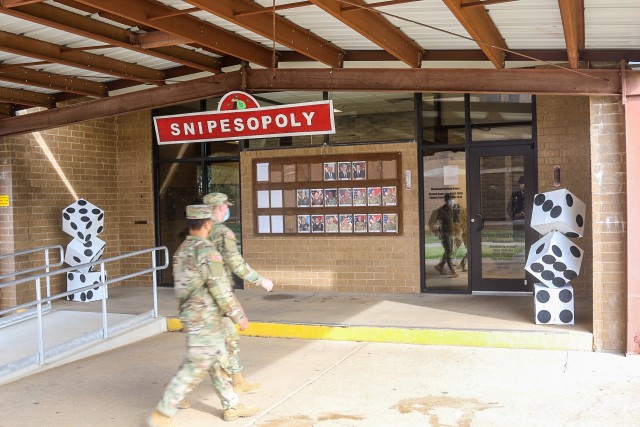 U.S. Army Soldiers from 1st Brigade Combat Team "Bastogne", 101st Airborne Division (Air Assault), walking up to the entrance of the monopoly themed Snipes Dining Facility to enjoy their Thanksgiving meal and the festivities Nov. 24 on Fort Campbell, Ky. Bastogne brigade upheld its annual traditional Thanksgiving meal for Soldiers, Friends, and Families within the unit for fellowship and esprit de corps.