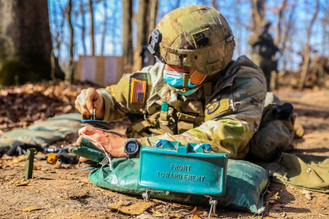 U.S. Army 1st Lt. Codi Morris, platoon leader, 2nd Battalion, 327th Infantry Regiment “No Slack”, 1st Brigade Combat Team “Bastogne”, 101st Airborne Division (Air Assault), prepares a claymore mine during Expert Infantry Badge training...