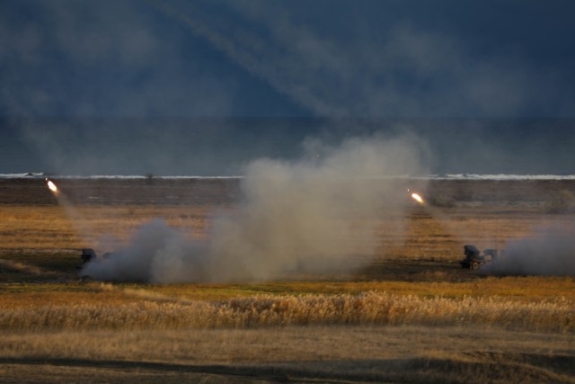 CAPU MIDIA, Romania -- Two Romanian Multiple Launch Rocket Systems fire rockets into the Black Sea during Exercise Rapid Falcon Nov. 19, 2020. This was 1st Battalion, 77th Field Artillery Regiment’s second live fire event since reactivation just...