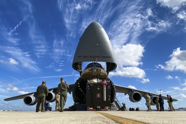 Soldiers assigned to U.S. Army North’s Task Force 51 and Airmen assigned to the 68th Airlift Squadron load the Sentinel, otherwise known as ARNORTH’s mobile command post, during the unit’s Level II Deployment Readiness Exercise (DRE), at...