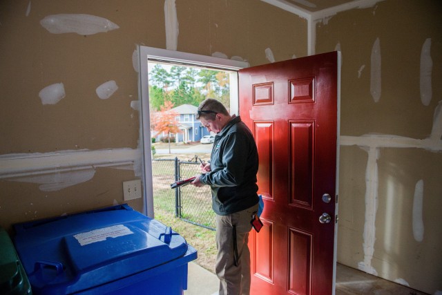 A housing inspector carries out a quality assurance inspection of a home in the Patton Village housing area with the aim of having it ready for occupancy by a military family at Fort Benning, Ga, Nov. 21, 2020. Fort Benning during the past year...