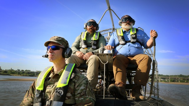 Tulsa District Biologist Stacy Dunkin (right) drives an airboat with fellow Biologist Jason Person and District Commander Col. Scott Preston while conducting Interior Least Tern surveys on the Arkansas River June 15, 2020.  The U.S. Army Corps of...