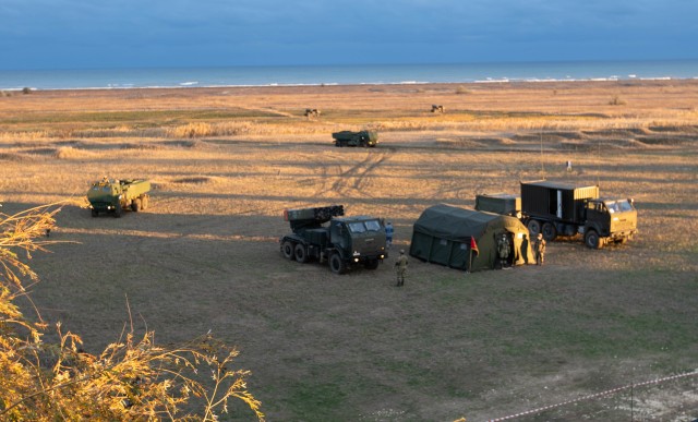 CAPU MIDIA, Romania -- U.S. and Romanian Forces gather in the staging area after the firing of a U.S. High Mobility Artillery Rocket System and Romanian Multiple Launch Rocket System into the Black Sea as part of Exercise Rapid Falcon Nov. 19,...