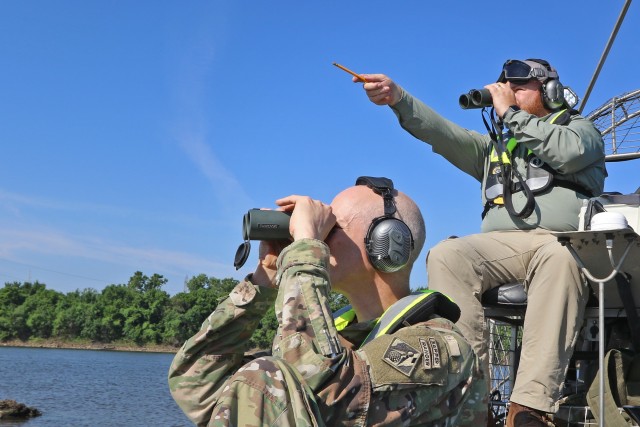 Tulsa District Biologist Jason Person (top) motions to District Commander Col. Scott Preston the direction of an Interior Least Tern nest on a sand bar in the Arkansas River June 15, 2020.  The U.S. Army Corps of Engineers, Tulsa District is...