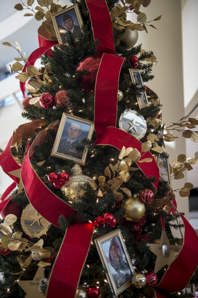 Photos of fallen Oklahoma National Guard members adorn the Oklahoma National Guard Gold Star Tree in the 3rd Floor atrium of the Oklahoma History Center in Oklahoma City, Nov. 25.
...