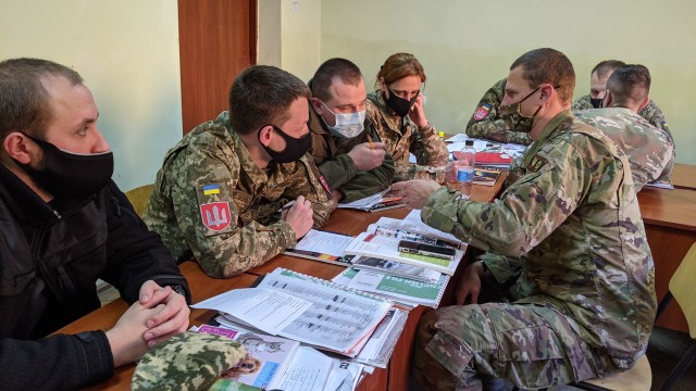 Cpt. Christopher Gorman speaks with Armed Forces of Ukraine cadets during a course instructed primarily in English at the Ukrainian National Army Academy in Lviv, Ukraine Nov. 26. (Photo by U.S. Army Cpl. Shaylin Quaid)