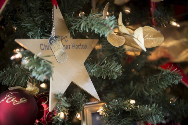 A gold star bearing the name of Spc. Christopher Horton adorns the Oklahoma National Guard Gold Star Tree in the 3rd Floor atrium of the Oklahoma History Center in Oklahoma City, Nov. 25.
...