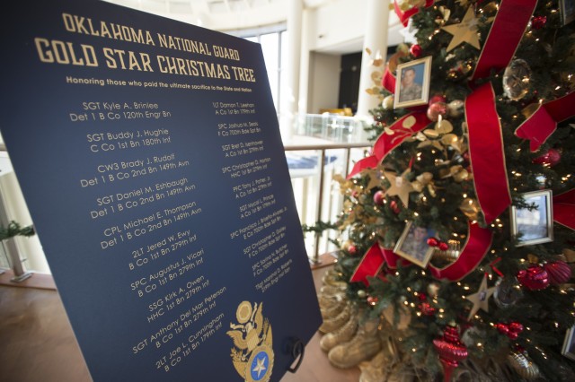 The names of the 20 Oklahoma National Guard members killed overseas since 9/11 are displayed alongside the Oklahoma National Guard Gold Star Tree in the 3rd Floor atrium of the Oklahoma History Center in Oklahoma City, Nov. 25.
...