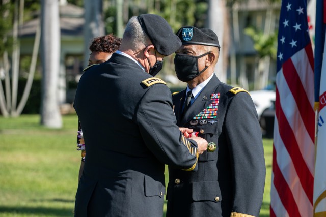 Gen. Paul J. LaCamera, U.S. Army Pacific commanding general, presents the distinguished service medal to Maj. Gen. Timothy M. McKeithen, deputy commanding general-Army National Guard, at his retirement ceremony Dec. 1 at Historic Palm Circle, Fort Shafter, Hawaii. McKeithen assumed duties as USARPAC’s senior National Guard general from March 2018 to Dec. 2020. (U.S. Army photo by Sgt. 1st Class Monik Phan)