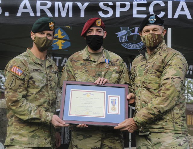 From Left to right, Col. Ryan Ehrler, commander, 1st Special Forces Group (Airborne), Sgt. Alexander Jabin, satellite operator/maintainer, 4th Battalion, 1st SFG (A), and Lt. Gen. Randy A. George, commanding general, I Corps and Joint Base...