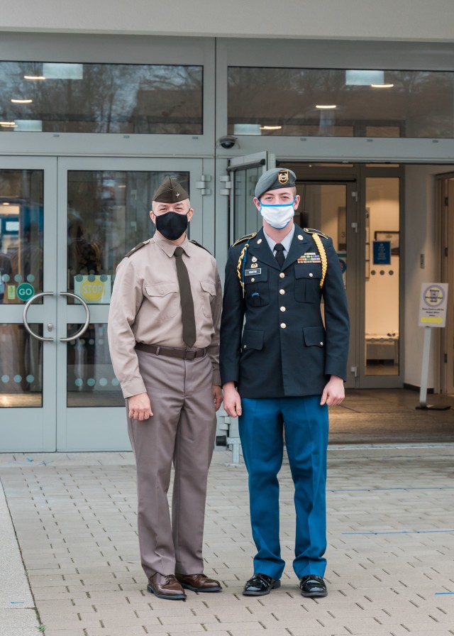 WIESBADEN, Germany – Brig. Gen. Jed Schaertl, senior responsible officer at U.S. Army Garrison Wiesbaden, and Sam Houston, senior and S3 Sgt. Maj.  of the JROTC, stand outside of Wiesbaden High School.