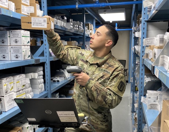 Pfc. Raul Cordova performs duties as a storage materiel handler at the U.S. Army Medical Materiel Center-Korea warehouse. His duties include picking of Class VIII medical supplies and transferring them over to the shipping section for shipment to customers.