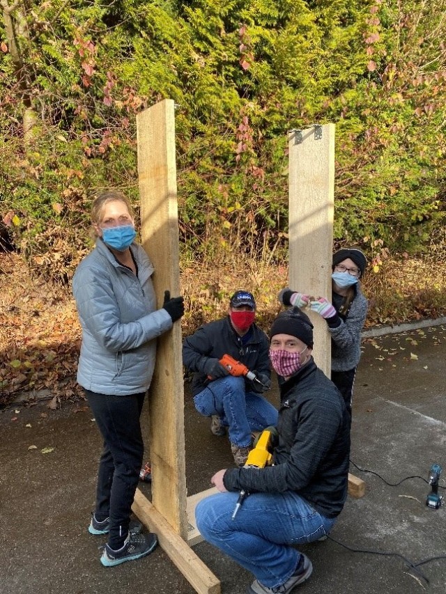 Volunteers craft wooden plant boxes