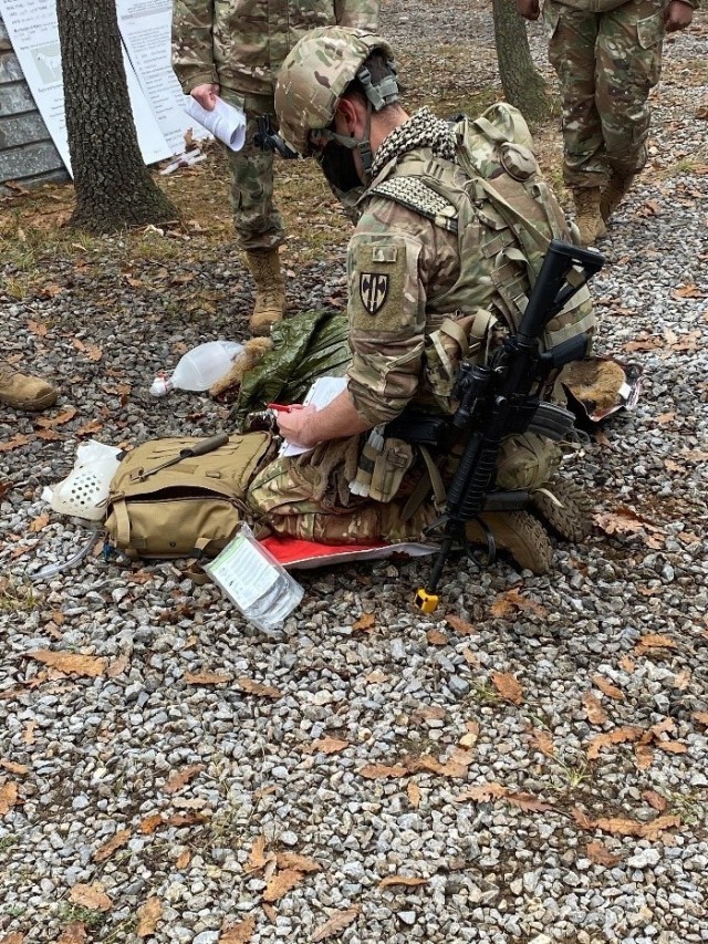 Cpl. Dustin Borchardt, a military working dog handler with the 100th Military Police Detachment, performs emergency care on a dog mannequin during K9 tactical combat casualty care at Camp Bondsteel, Kosovo, on Nov. 21, 2020. He later evacuated the mock casualty to a safe location to provide further treatment while waiting for medical evacuation. (Courtesy photo)