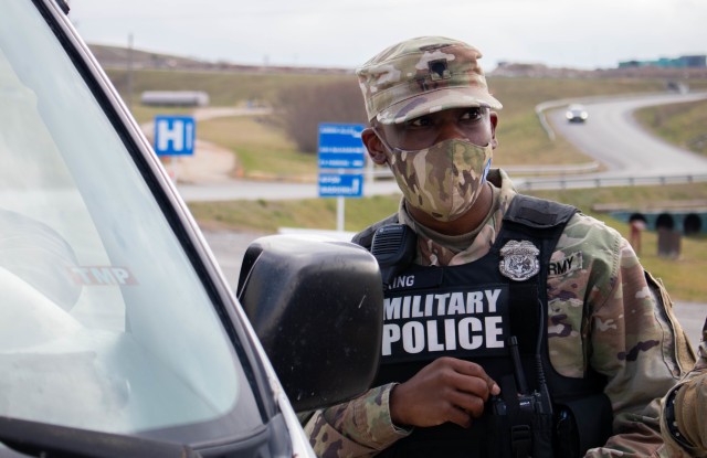 U.S. Army Reserves Spc. Nyriq King, a vehicle accident investigator with the 423rd Military Police Company out of Long Island, New York, conducts a traffic stop during a routine patrol at Camp Bondsteel, Kosovo, on Dec. 3, 2020. Traffic accident...