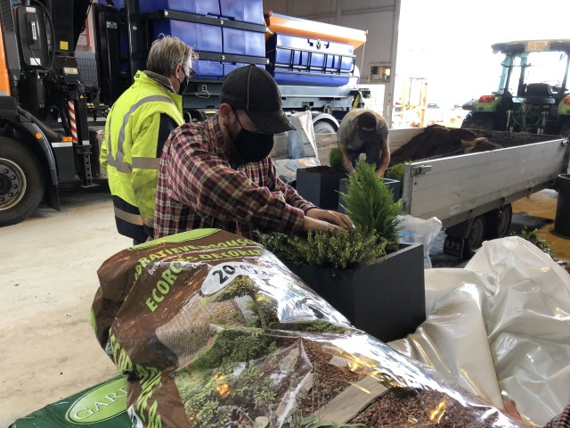 Workers with the Directorate of Public Works unload plants to replant at Chievres Air Base Nov. 19. (U.S. Army photo by Christophe Morel, USAG Benelux Public Affairs)