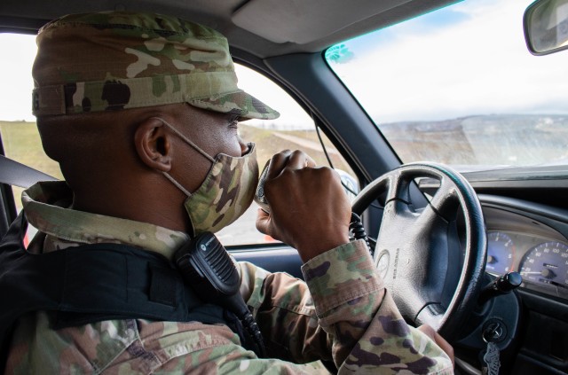 U.S. Army Reserves Spc. Nyriq King, a vehicle accident investigator with the 423rd Military Police Company out of Long Island, New York, conducts a traffic stop during a routine patrol at Camp Bondsteel, Kosovo, on Dec. 3, 2020. Traffic accident investigators like King are specially trained to enforce traffic safety and respond to vehicle accidents. King deployed to Kosovo in March 2020 to support Kosovo Force 27, a NATO organization dedicated to the safety and security of all people in Kosovo. After serving his time for KFOR 27, King extended his contract to serve on KFOR 28, citing his love of the country and the job. (U.S. Army National Guard photo by Sgt. Jonathan Perdelwitz)