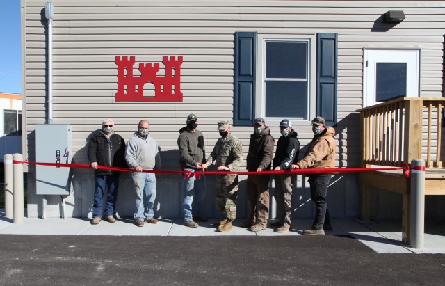 Col. Bill Hannan together with the team who works at Gasconade River Office to cut the ribbon Dec. 1, 2020: left to right, Randall Faherty, Brandon Willis, Kenneth Schneider, Col. Hannan, Nick Slocum, Michael McMillian and Kevin Tune - cutting the...