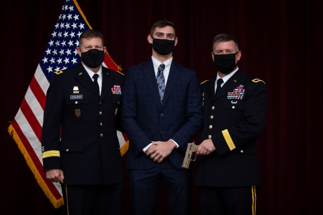 U.S. Army Reserve Maj. Gen. Mark W. Palzer, commanding general of the 99th Readiness Division poses for a photo with Ryan and Brig. Gen. Kevin Meisler during the latter's promotion ceremony at Joint Base San Antonio-Fort Sam Houston Dec. 5, 2020....