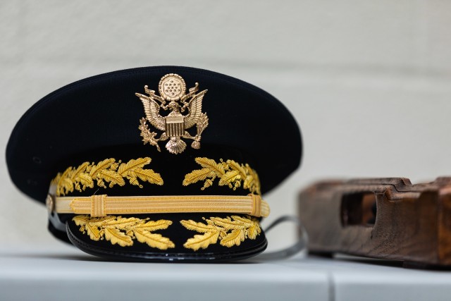 A general officer's service cap sits on a desk along with accouterments during the promotion of U.S. Army Reserve Col. Kevin Meisler. Meisler was promoted to brigadier general during a ceremony held at Joint Base San Antonio-Fort Sam Houston Dec. 5, 2020. With the promotion, Meisler will take command of the 4th Sustainment Command (Expeditionary), which directs more than 6,500 Army Reserve Soldiers throughout Texas, Oklahoma, Arkansas, and New Mexico. (U.S. Army photo by Capt. David Gasperson)