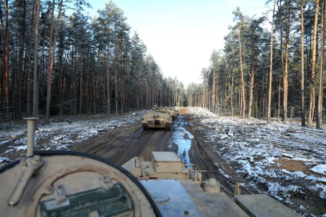 M1 Abrams tanks travel across a frozen tank trail to the Pabrade Training Area, Lithuania on Dec. 1, 2020. The tanks and crews are a part of 2nd Battalion, 8th Cavalry Regiment, 1st Armored Brigade Combat Team, 1st Cavalry Division who recently...
