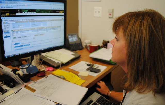 After working for 24 years in legacy systems, Budget Analyst Cheryl Brophy now processes actions in the GFEBS system. (Photo by Pamella B. Gray, PM GFEBS)